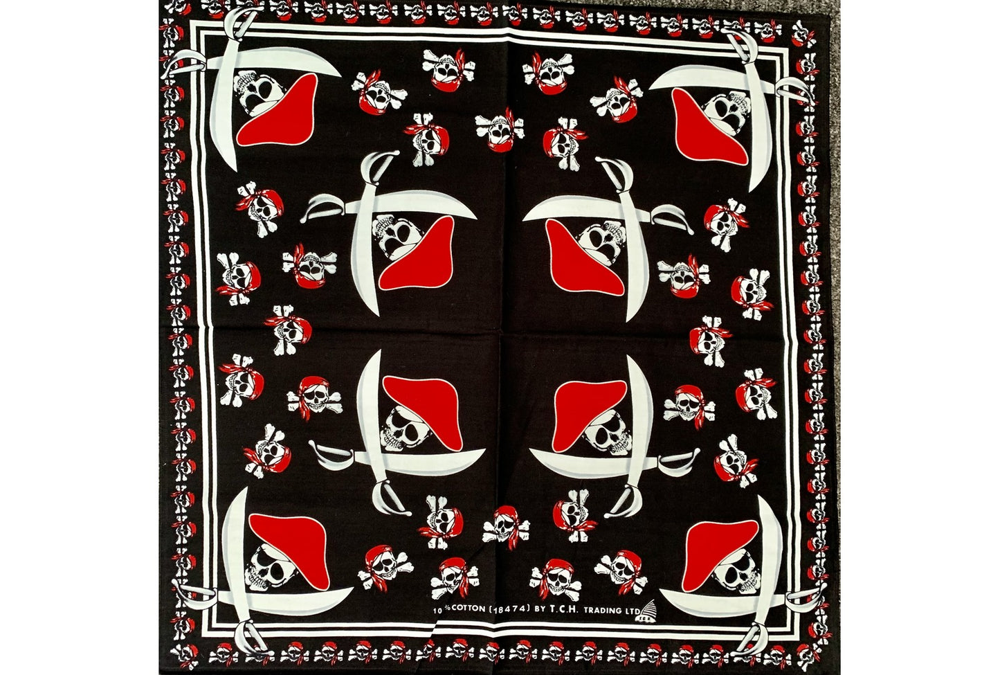 black bandana with pirate skull and bones and hat with swords in different sizes