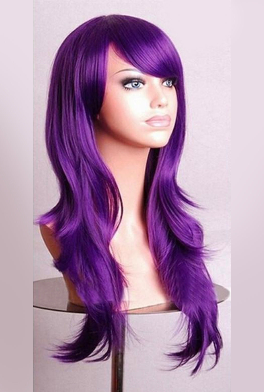 A mannequin head showcasing a long wavy deep purple wig.
